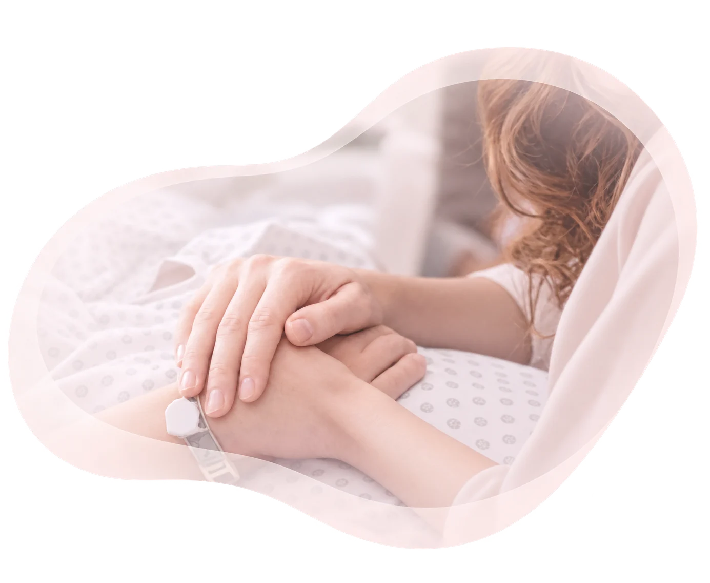 Two people holding hands, one hand resting gently over the other